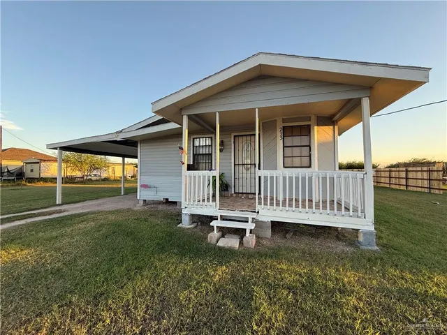 a backyard of a house with a deck