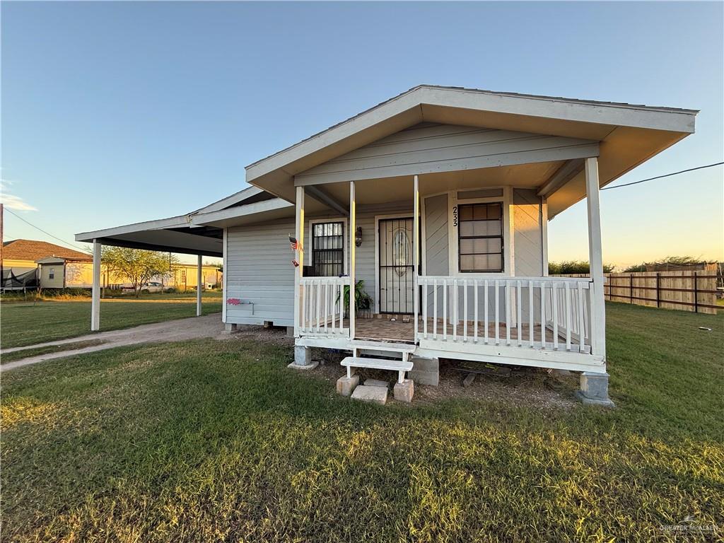 233 Buena Tierra Street Donna, TX 78537 - Photo 5 of 11 a backyard of a house with a deck