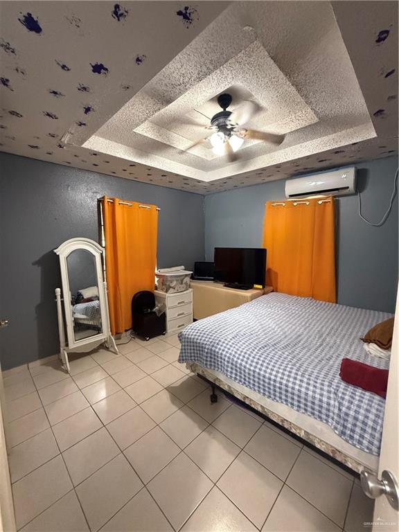 233 Buena Tierra Street Donna, TX 78537 - Photo 10 of 11 a bedroom with bed and window