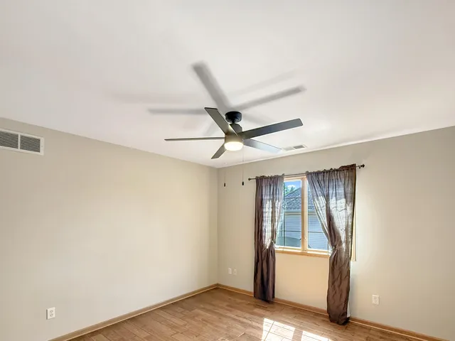 a spacious bathroom with a double vanity sink mirror and double