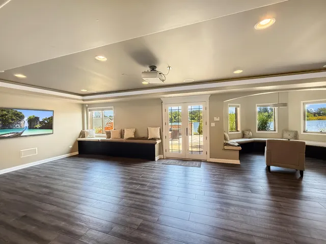 a kitchen with stainless steel appliances granite countertop a kitchen island a table and chairs