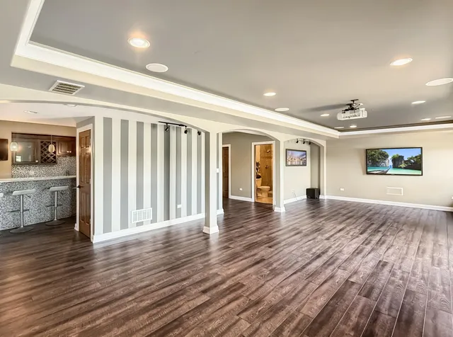 a view of swimming pool with outdoor seating and lake