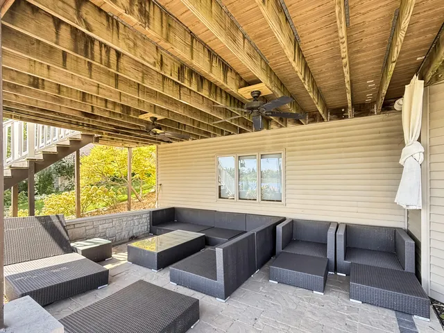 a view of a lake with sunset in background