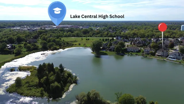 a large body of water with a table and chairs
