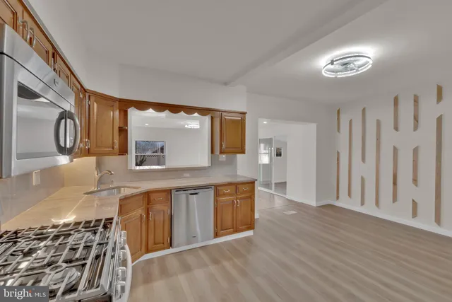 a large bathroom with a sink and a large mirror