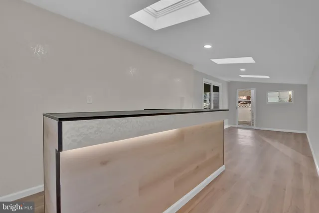 a view of livingroom with hardwood floor and hallway