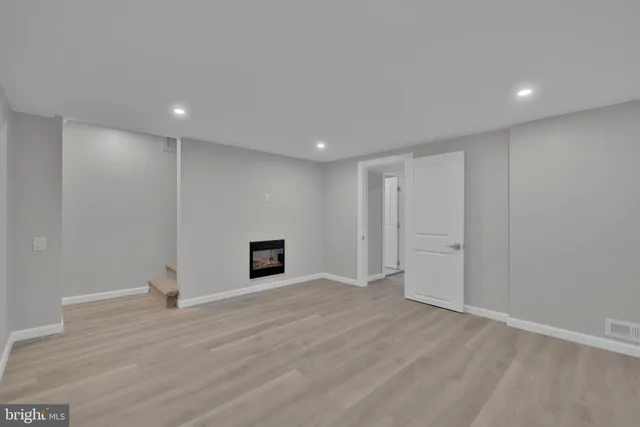 a view of a hallway with a room