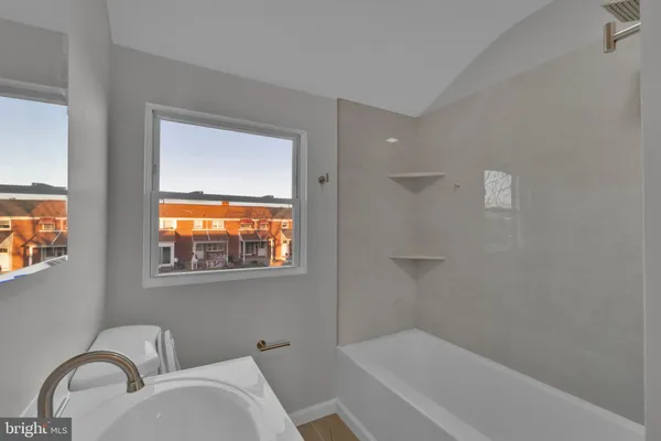 a bathroom with a sink and shower