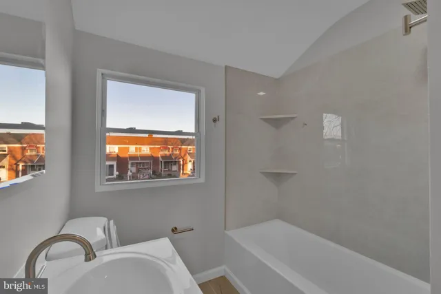 a bathroom with a sink and shower