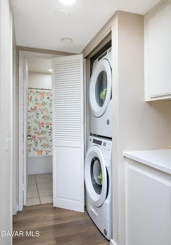 a view of a storage and utility room with washer and dryer