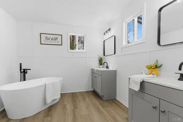 a bathroom with a bathtub and a sink