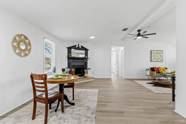 a view of a livingroom with furniture and a table