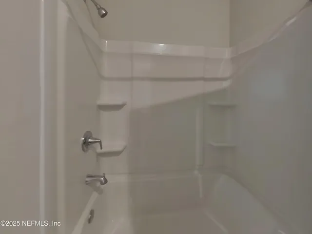 a close view of a bathtub in bathroom