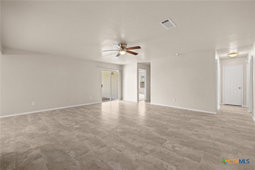 214 Timber Ridge Drive Nolanville, TX 76559 - Photo 11 of 31 an empty room with a ceiling fan and a window