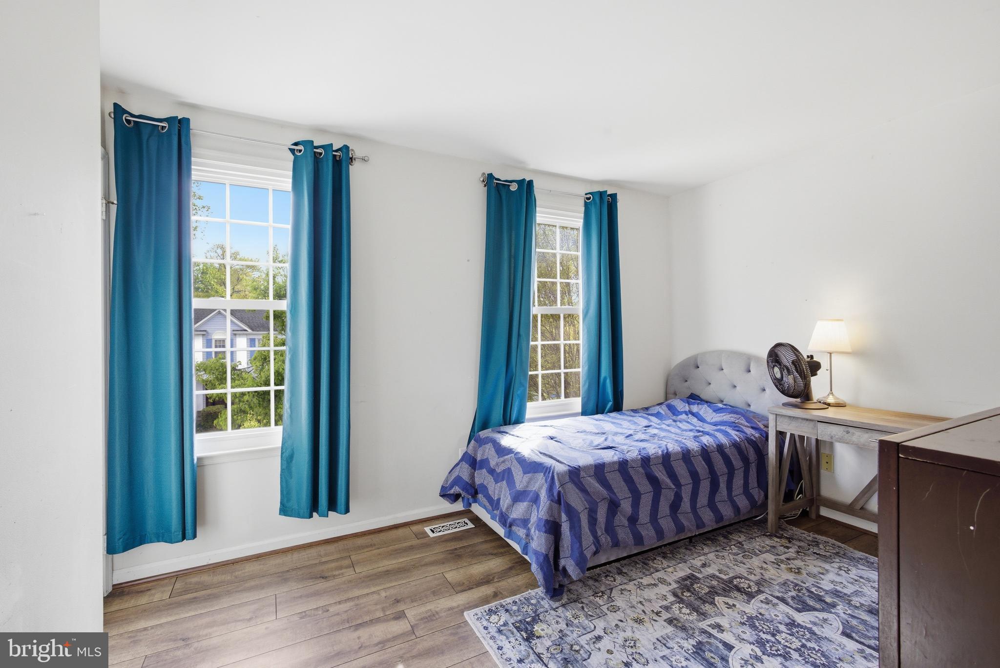 8664 Pohick Forest Court Springfield, VA 22153 - Photo 30 of 41 a bedroom with a bed and a window