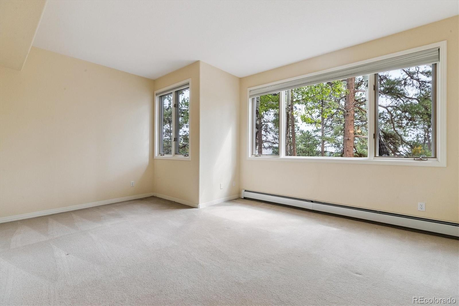 981 Sleepy Hollow Road Golden, CO 80401 - Photo 33 of 50 an empty room with windows