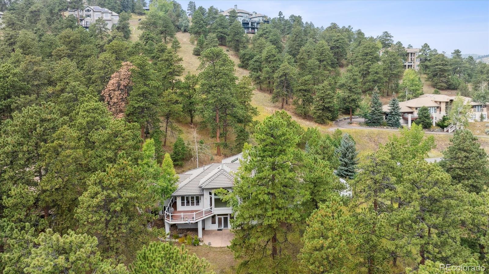 981 Sleepy Hollow Road Golden, CO 80401 - Photo 45 of 50 a view of a house with a yard and tree s