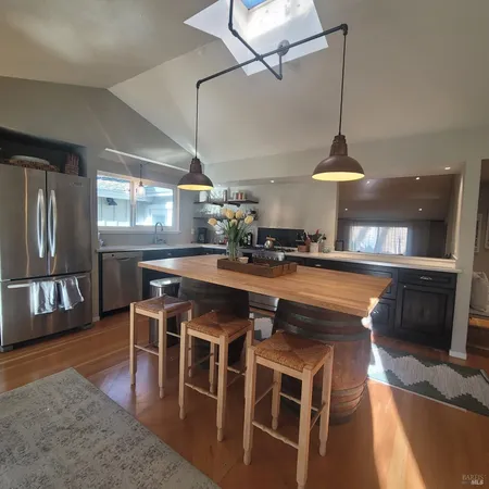 a kitchen with a table and chairs