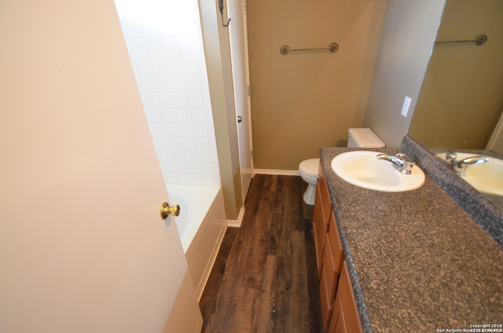 9139 Laguna Selma, TX 78154 - Photo 6 of 10 a bathroom with a sink and a mirror