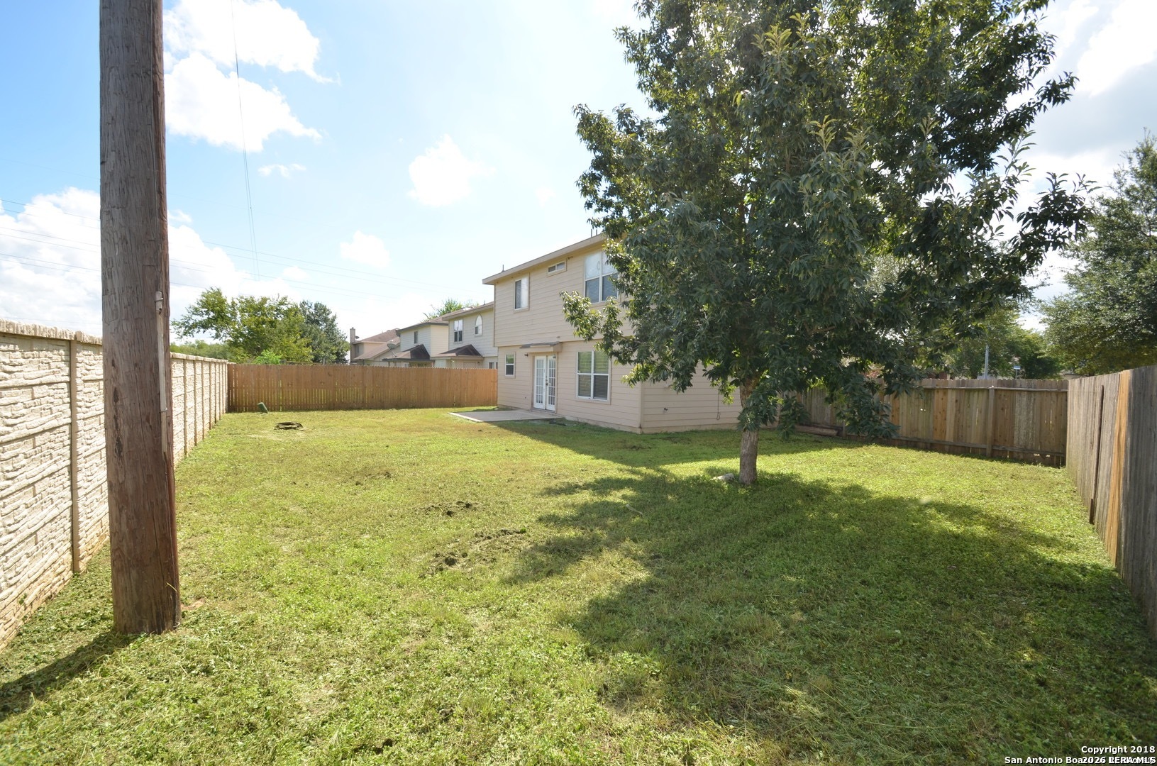 9139 Laguna Selma, TX 78154 - Photo 10 of 10 a view of a yard with a tree
