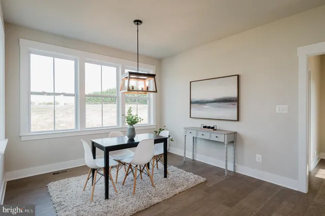 a bedroom with a bed and a mirror