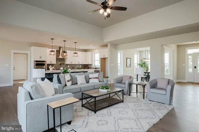 a kitchen with kitchen island granite countertop a sink a center island and cabinets