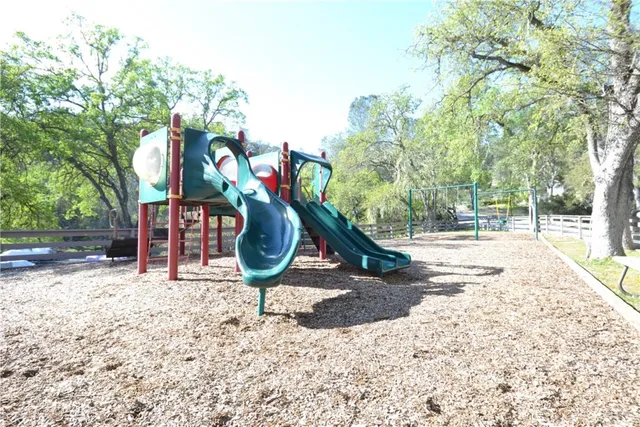 a childrens park with lots of trees