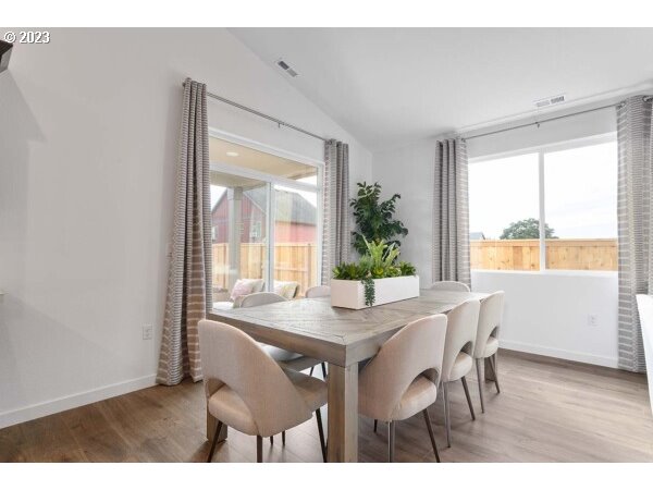 313 West 19th Street Lafayette, OR 97127 - Photo 11 of 18 a view of a dining room with furniture and wooden floor