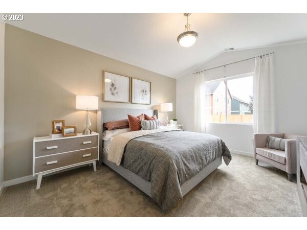 313 West 19th Street Lafayette, OR 97127 - Photo 12 of 18 a spacious bedroom with a bed and a couch