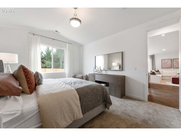 313 West 19th Street Lafayette, OR 97127 - Photo 13 of 18 a bedroom with a bed and a lamp