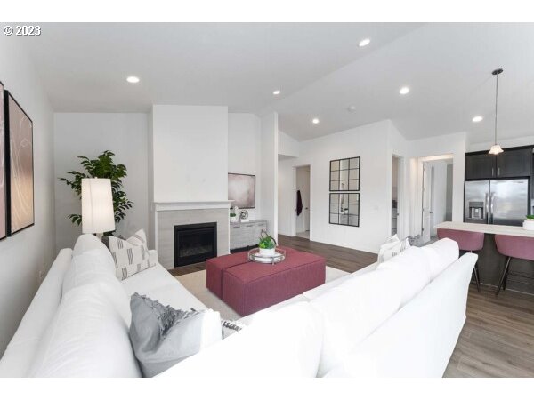 313 West 19th Street Lafayette, OR 97127 - Photo 9 of 18 a living room with furniture a fireplace and a table