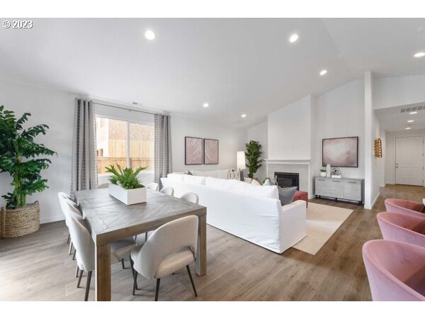 313 West 19th Street Lafayette, OR 97127 - Photo 10 of 18 a living room with furniture potted plant and a window