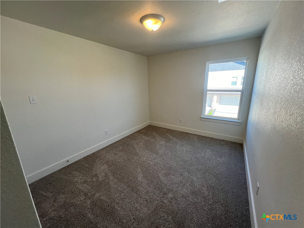 1822 Royal Loop Belton, TX 76513 - Photo 14 of 22 an empty room with windows