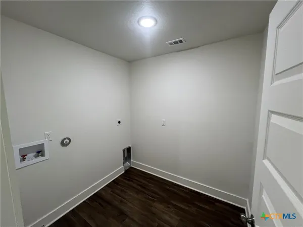 a view of room with hardwood floor