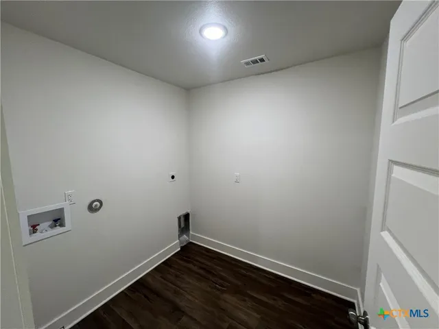 a view of room with hardwood floor