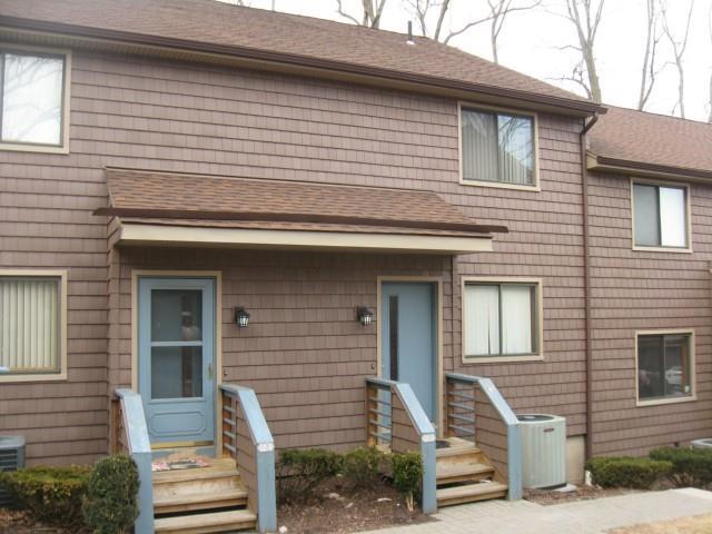 166 Old Brookfield Road, Unit 125 Danbury, CT 06811 - Photo 1 of 1 a front view of a house