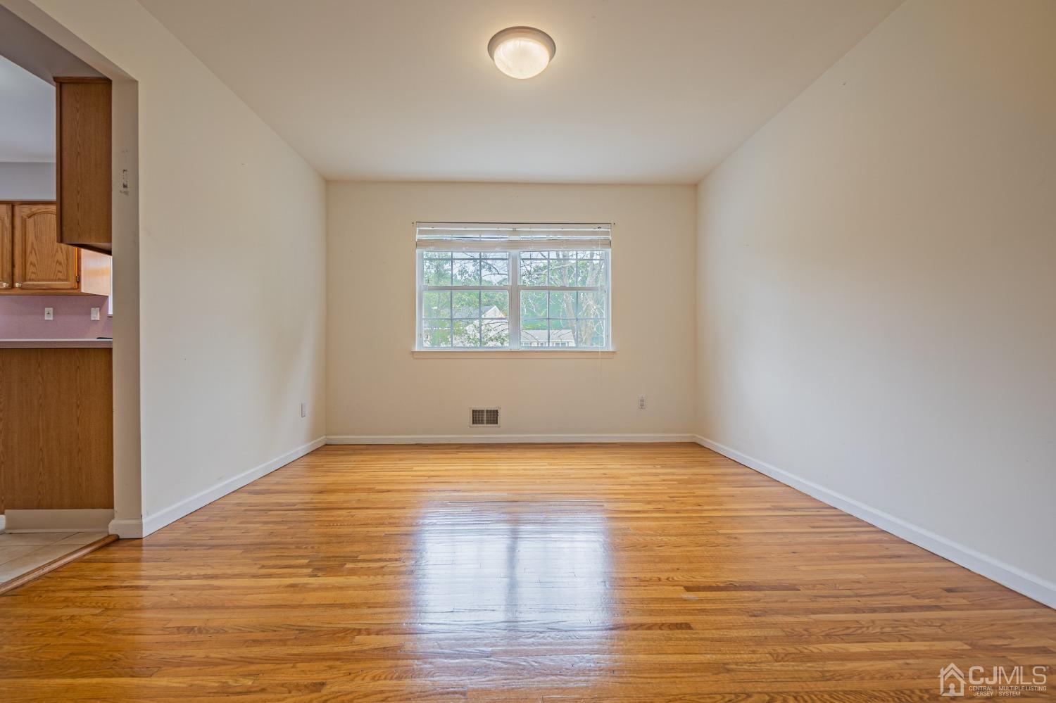 6 Sarah Court Edison, NJ 08817 - Photo 11 of 34 a view of a room with wooden floor and windows