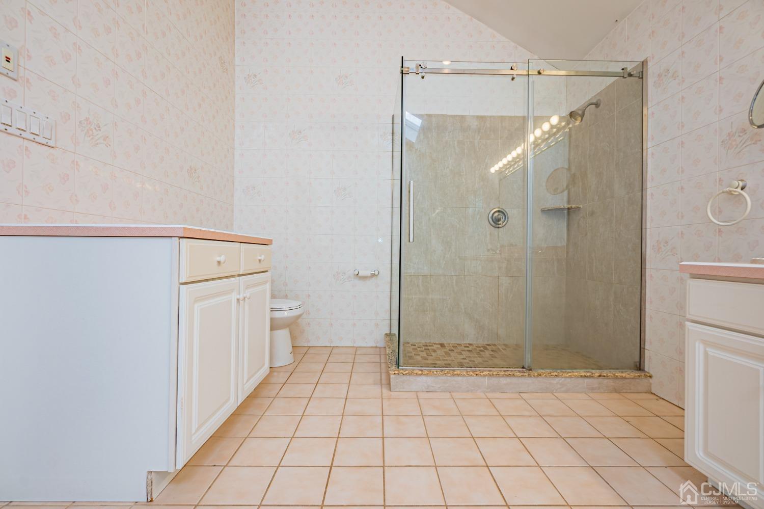 6 Sarah Court Edison, NJ 08817 - Photo 15 of 34 a bathroom with a shower and a toilet