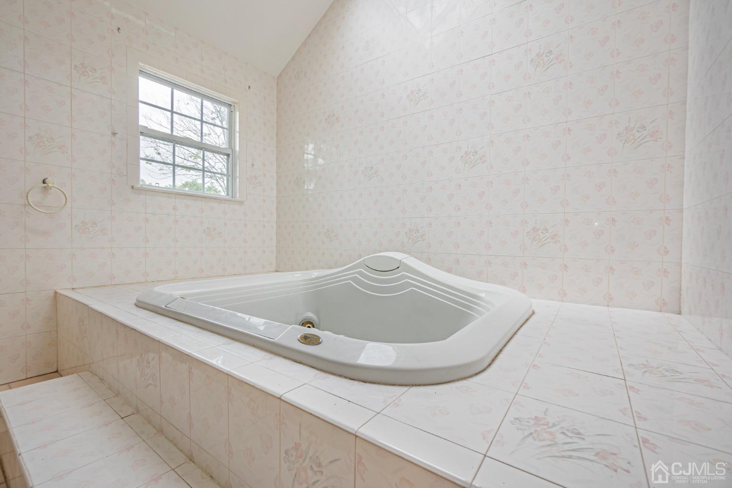 6 Sarah Court Edison, NJ 08817 - Photo 16 of 34 a bathroom with a bathtub and window