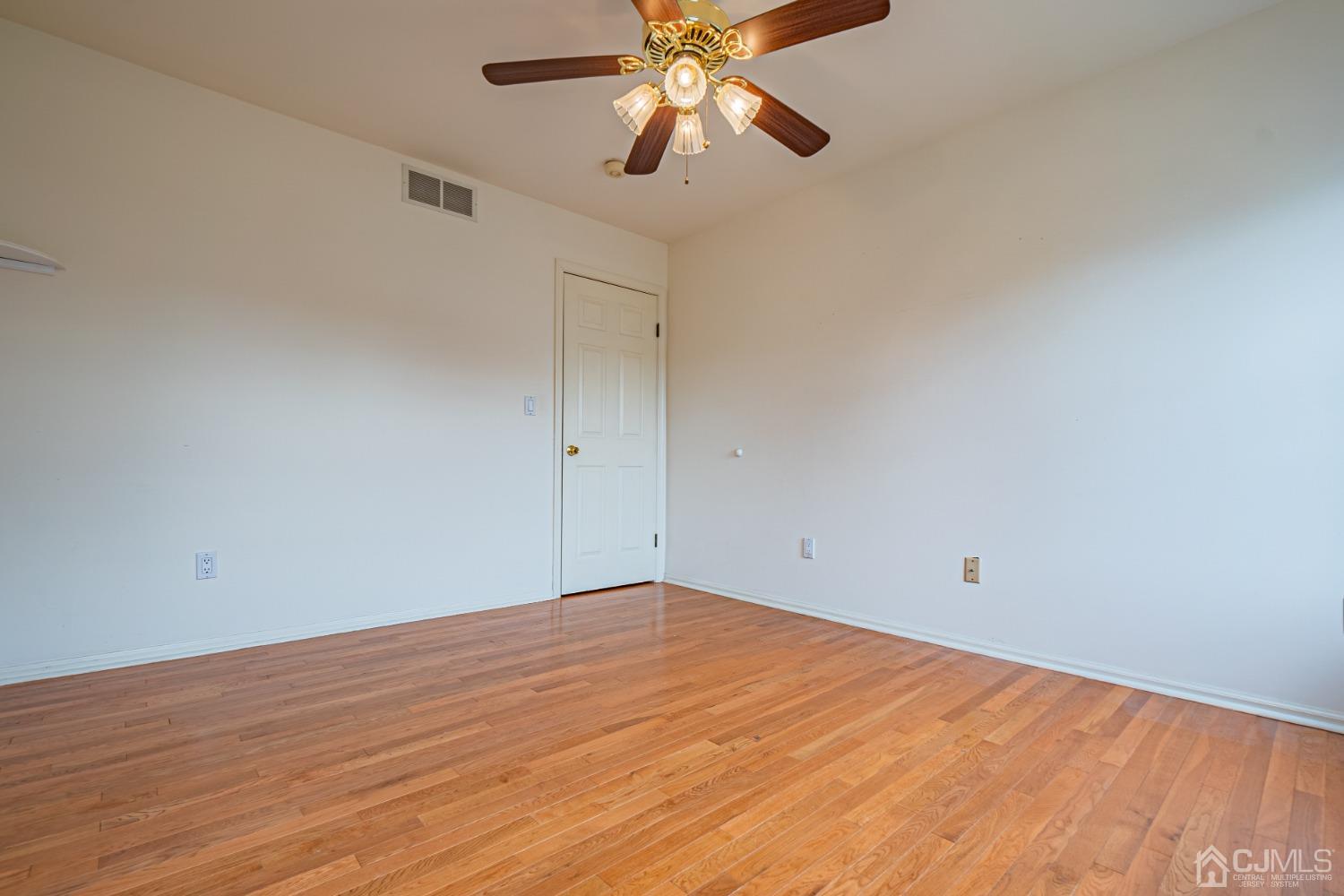 6 Sarah Court Edison, NJ 08817 - Photo 21 of 34 wooden floor in an empty room