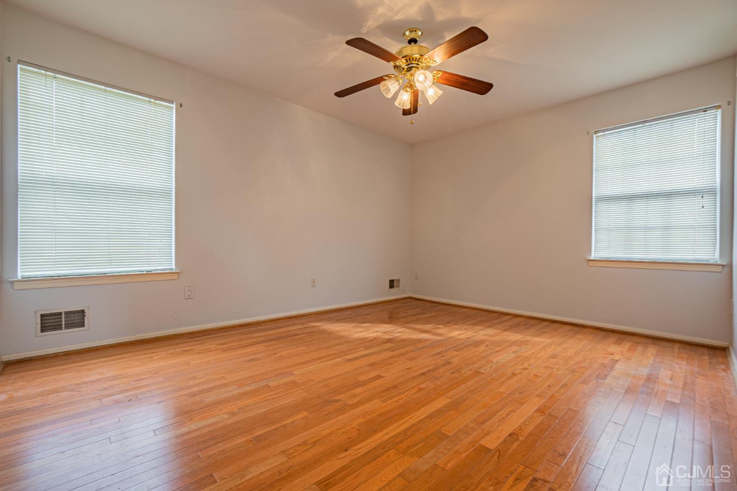 6 Sarah Court Edison, NJ 08817 - Photo 22 of 34 an empty room with a window and a fan