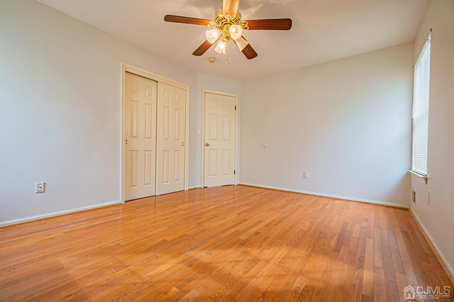 6 Sarah Court Edison, NJ 08817 - Photo 23 of 34 a view of empty room with wooden floor