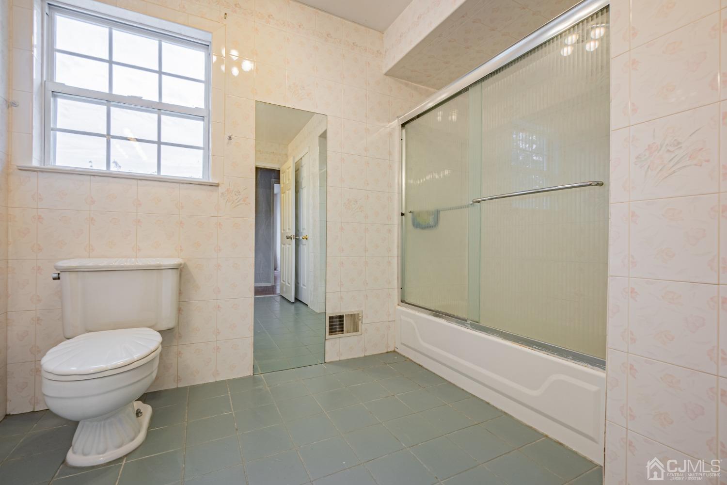 6 Sarah Court Edison, NJ 08817 - Photo 25 of 34 a bathroom with a toilet and a shower