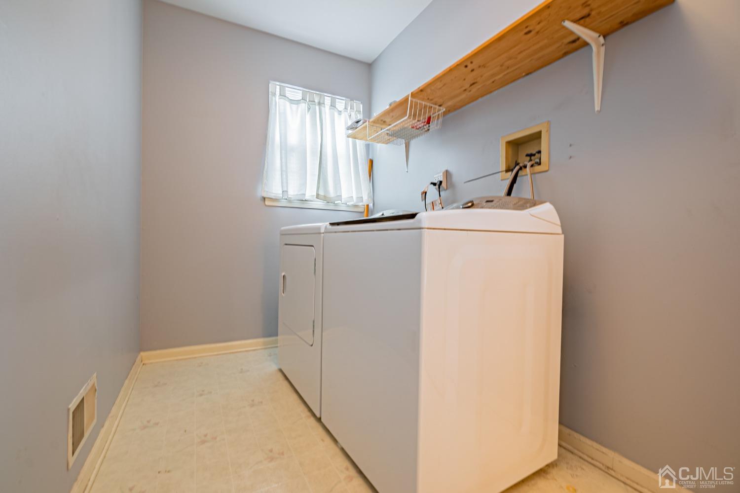 6 Sarah Court Edison, NJ 08817 - Photo 27 of 34 a utility room with dryer and washer