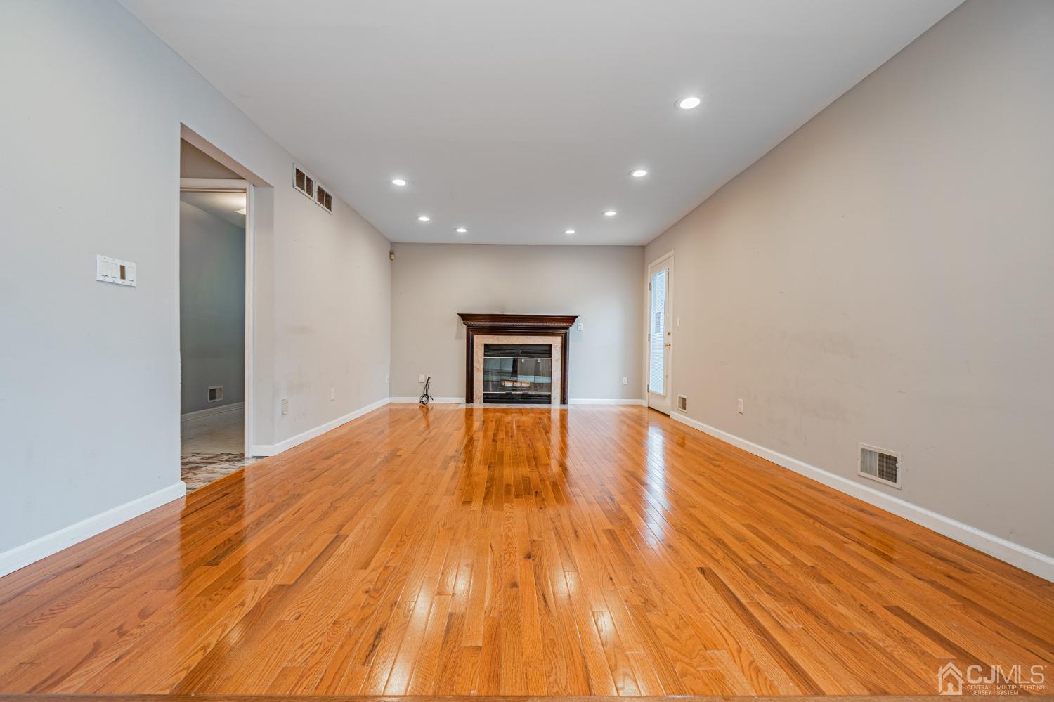 6 Sarah Court Edison, NJ 08817 - Photo 7 of 34 a view of empty room with wooden floor