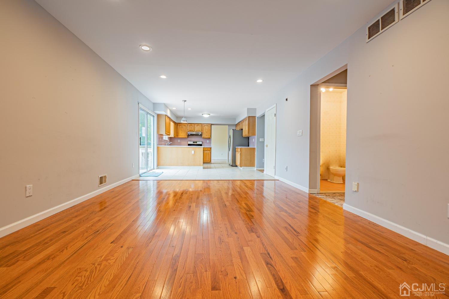6 Sarah Court Edison, NJ 08817 - Photo 8 of 34 a view of empty room with wooden floor and fan