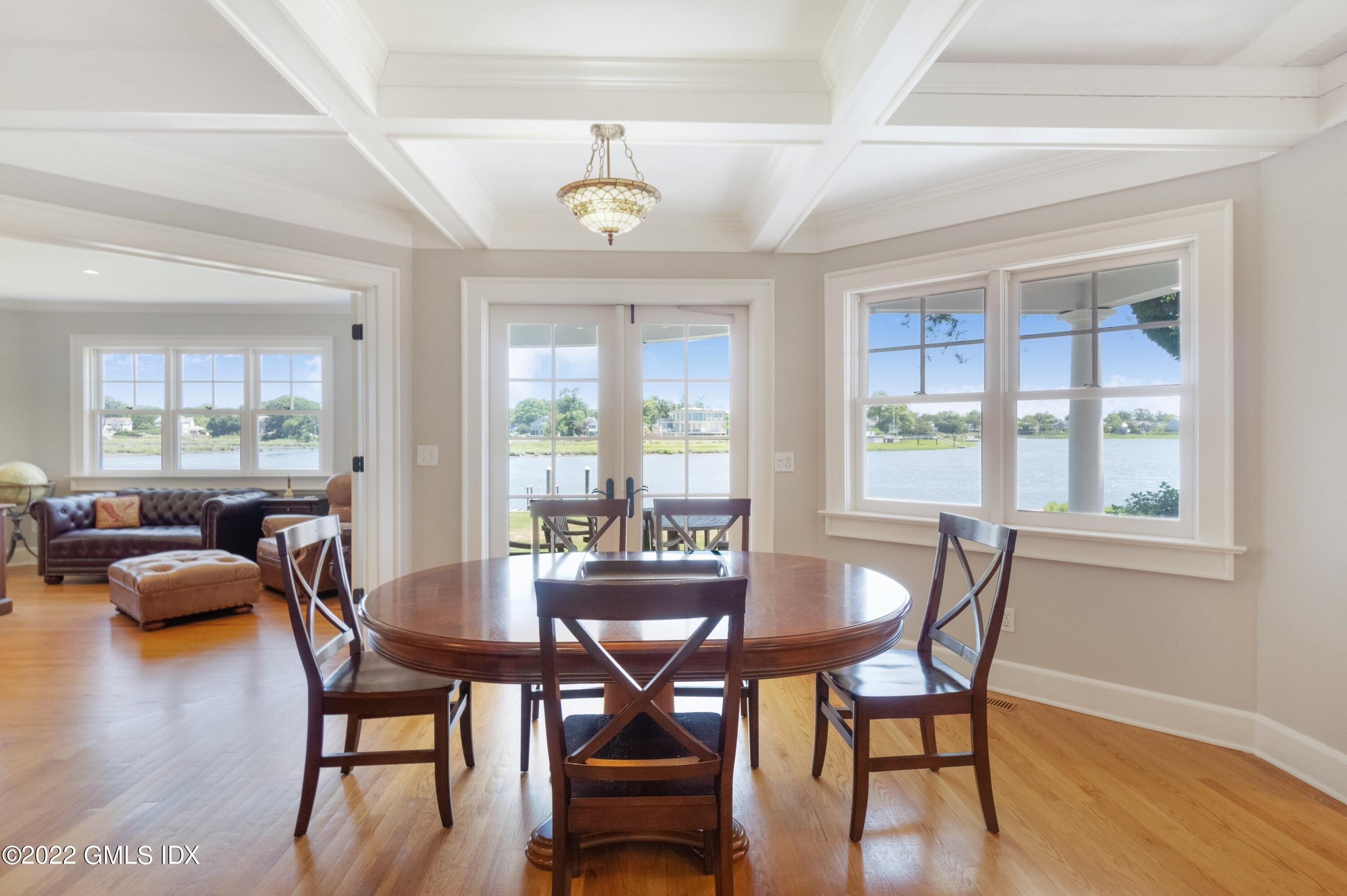 27 Willowmere Circle Riverside, CT 06878 - Photo 11 of 33 a view of a dining room with furniture wooden floor and chandelier