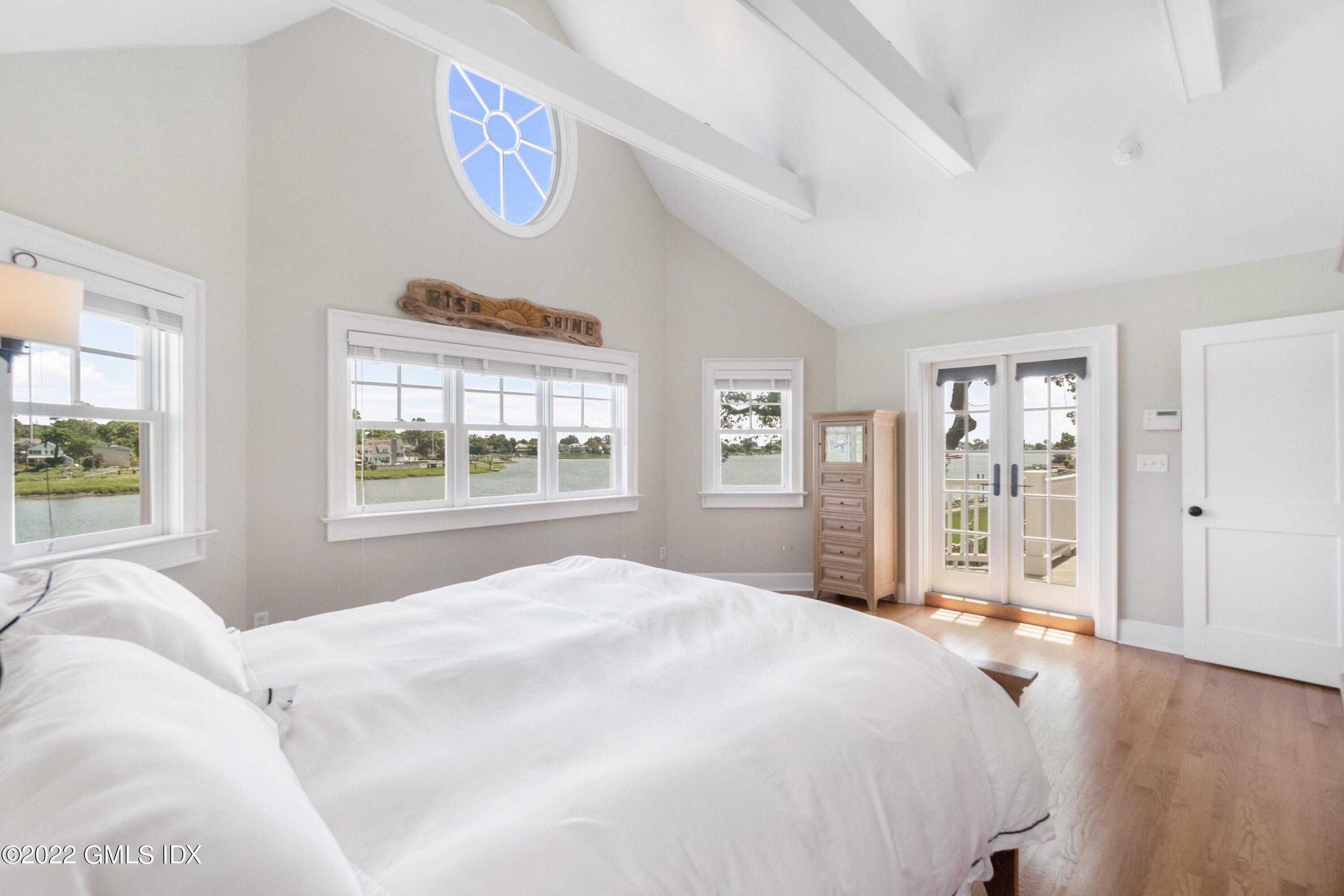 27 Willowmere Circle Riverside, CT 06878 - Photo 16 of 33 a bedroom with a large bed and a window