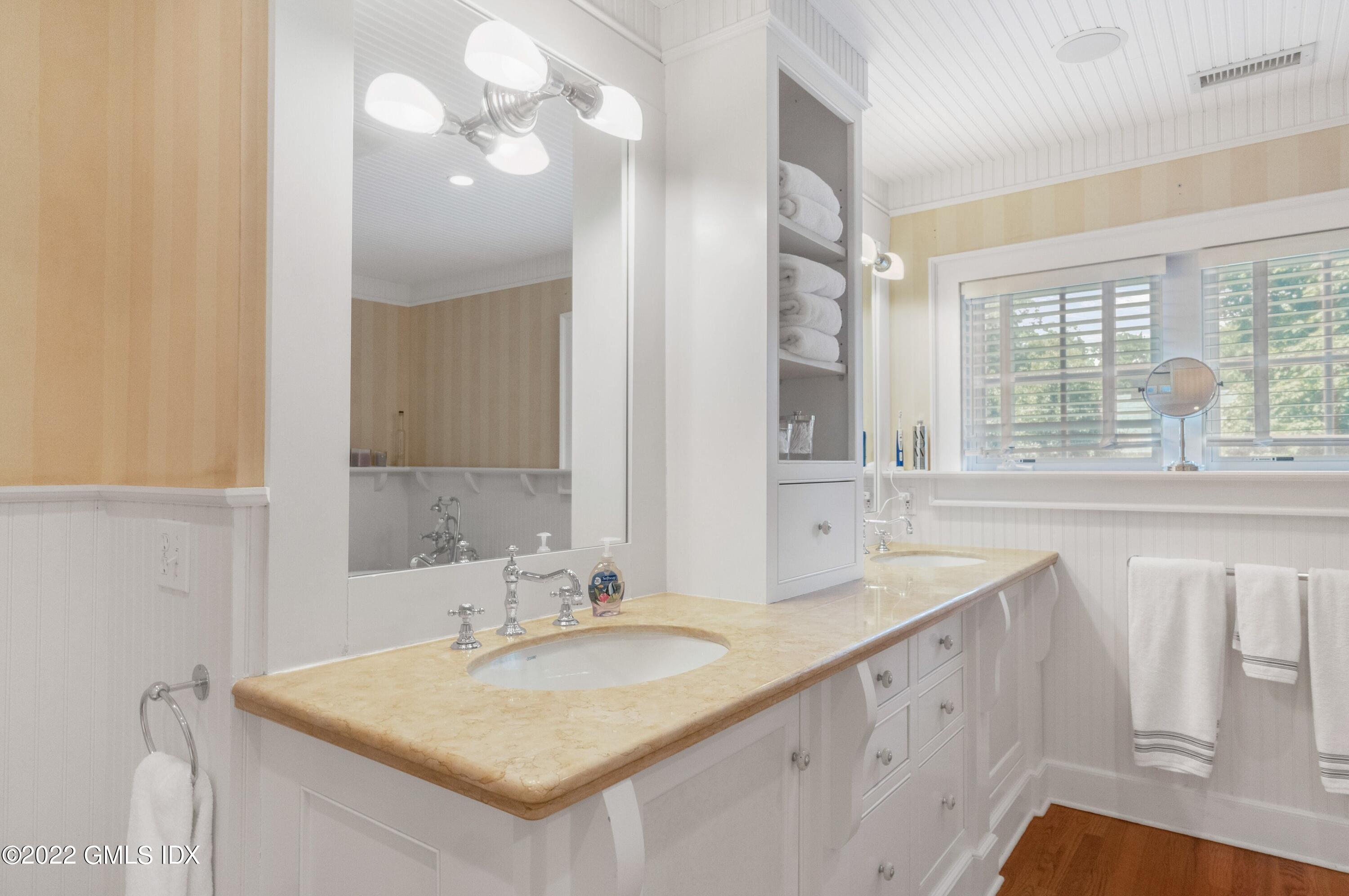 27 Willowmere Circle Riverside, CT 06878 - Photo 18 of 33 a bathroom with a sink double vanity and a mirror