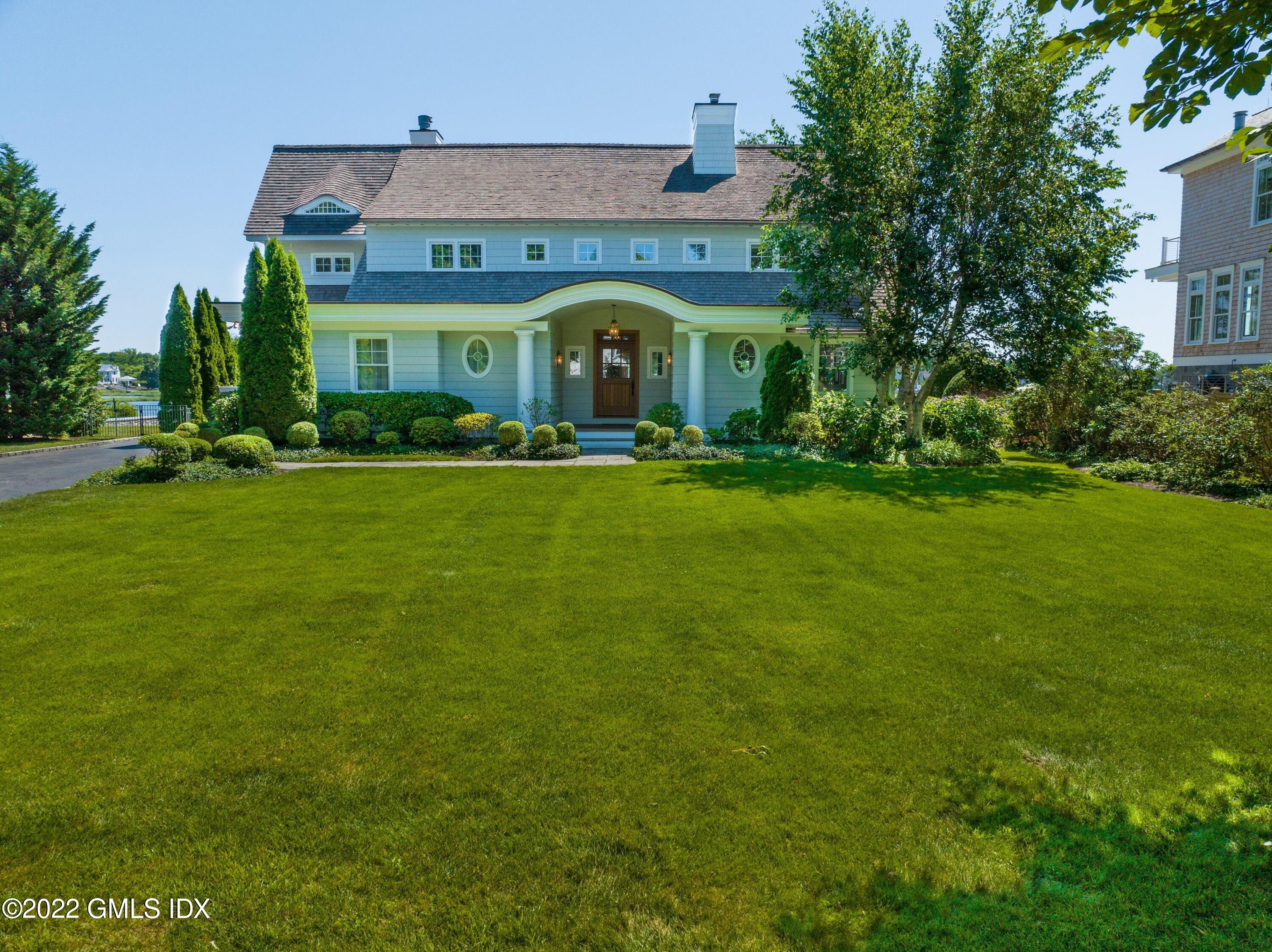 27 Willowmere Circle Riverside, CT 06878 - Photo 2 of 33 a view of house with garden and entertaining space